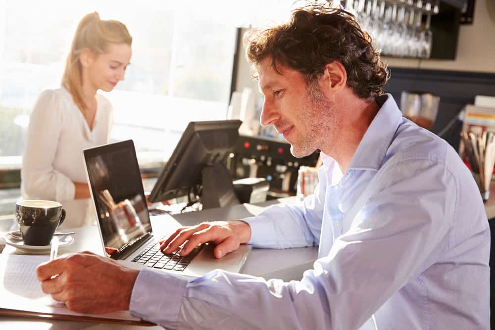 Restaurant owner on computer